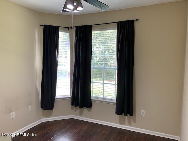 10550 Baymeadows Road, Unit 618 Jacksonville, FL 32256 - Photo 14 of 15 an empty room with wooden floor and windows