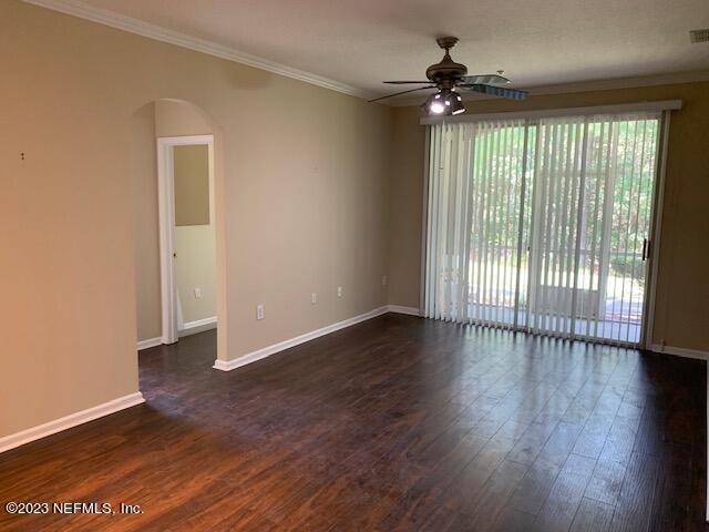 10550 Baymeadows Road, Unit 618 Jacksonville, FL 32256 - Photo 5 of 15 wooden floor in an empty room with a window