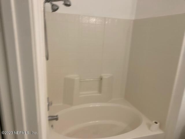 10550 Baymeadows Road, Unit 618 Jacksonville, FL 32256 - Photo 9 of 15 a white bath tub sitting next to a white sink