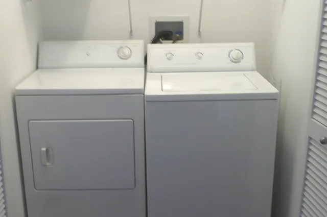 a utility room with dryer and washer
