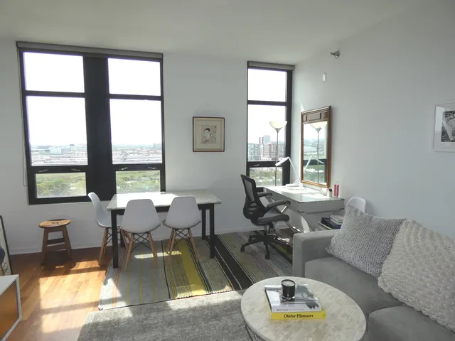a living room with furniture and a window