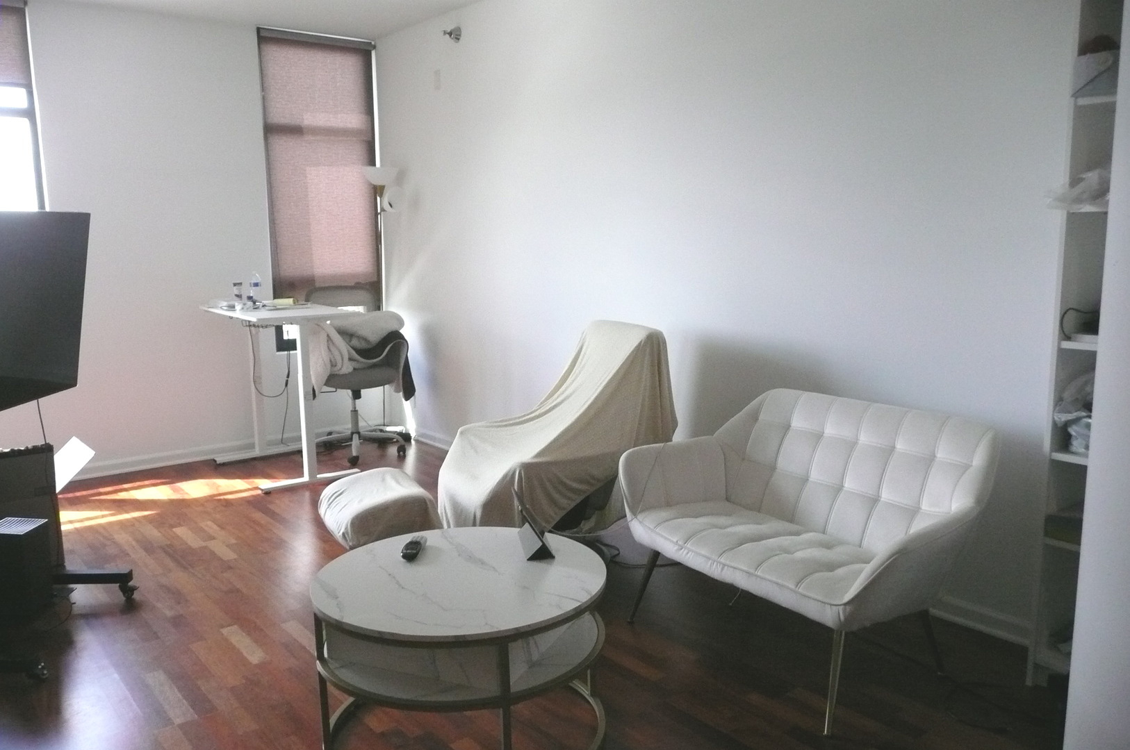 1255 South State Street, Unit 1414 Chicago, IL 60605 - Photo 7 of 24 a living room with furniture a flat screen tv and wooden floor
