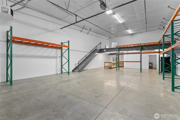 a view of an empty room with stairs