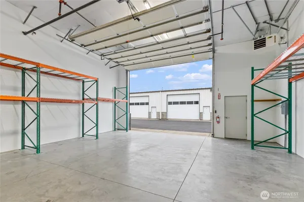 a view of storage and utility room with washer and dryer