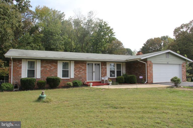 11235 Country Road Dunkirk, MD 20754 - Photo 1 of 8 a front view of house with yard outdoor seating and barbeque oven