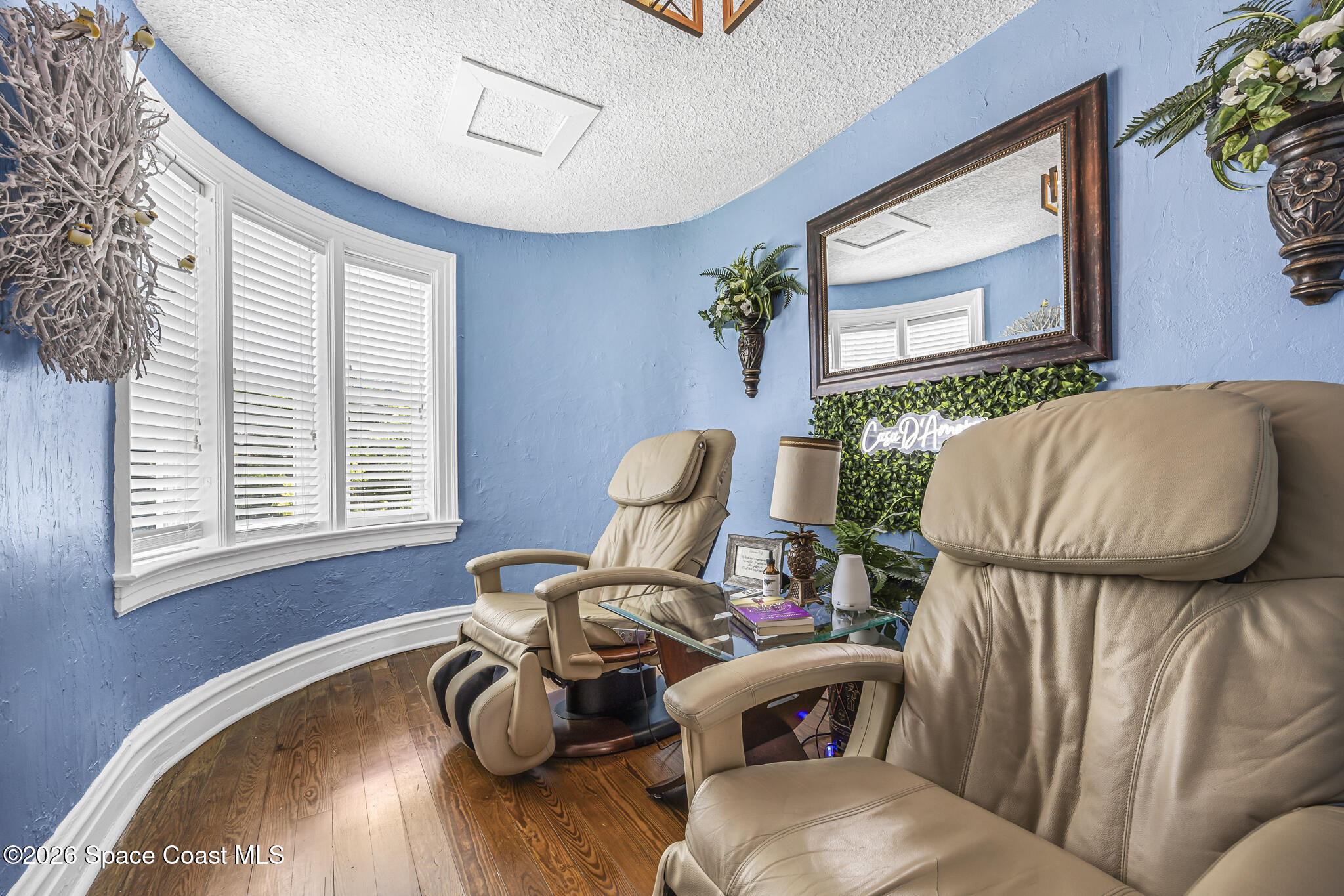 130 Valencia Road Rockledge, FL 32955 - Photo 30 of 66 a living room with furniture flowerpot and window