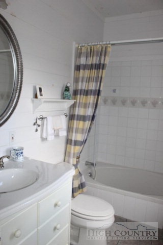1824 Benge Ashe Road Purlear, NC 28665 - Photo 12 of 22 a bathroom with a sink a toilet and shower