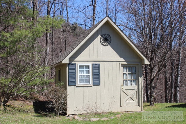 1824 Benge Ashe Road Purlear, NC 28665 - Photo 14 of 22 a front view of a house with garden