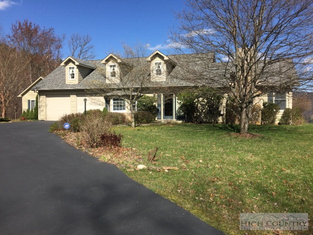 1824 Benge Ashe Road Purlear, NC 28665 - Photo 19 of 22 a front view of a house with a yard