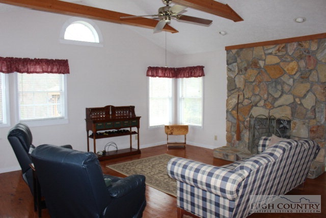 1824 Benge Ashe Road Purlear, NC 28665 - Photo 3 of 22 a living room with furniture a window and a flat screen tv