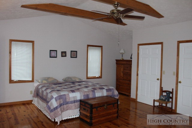 1824 Benge Ashe Road Purlear, NC 28665 - Photo 5 of 22 a bedroom with a bed dresser and a window