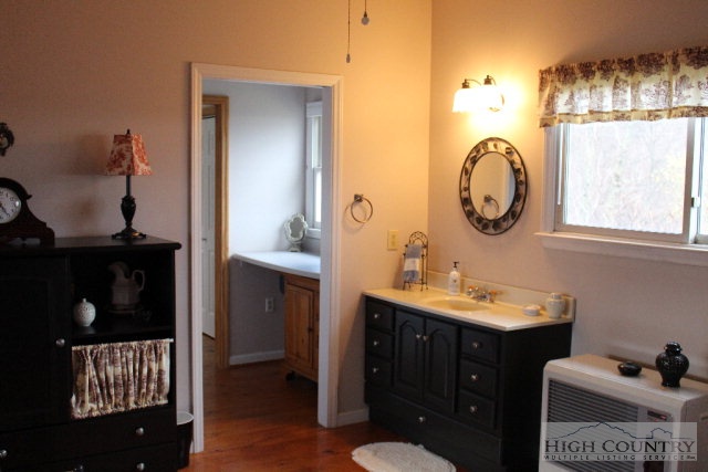 1824 Benge Ashe Road Purlear, NC 28665 - Photo 8 of 22 a bathroom with a sink and a mirror