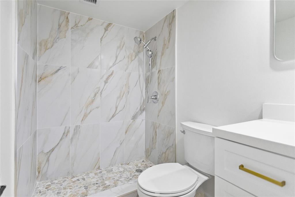 3000 South Course Drive, Unit 607 Pompano Beach, FL 33069 - Photo 27 of 33 a white toilet and shower curtain