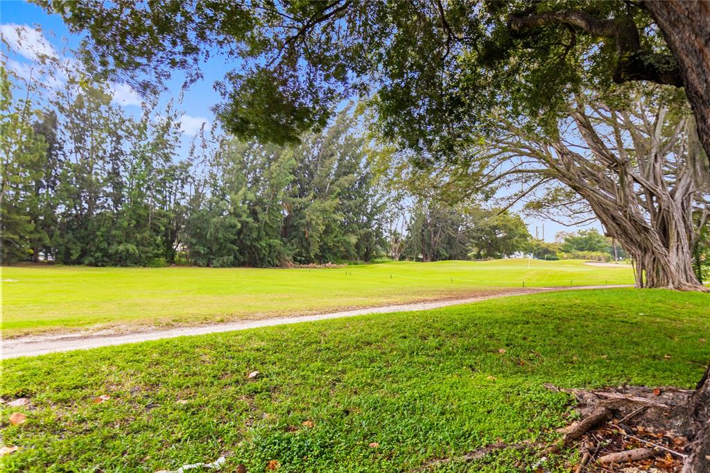 3000 South Course Drive, Unit 607 Pompano Beach, FL 33069 - Photo 33 of 33 a view of a yard with an outdoor space