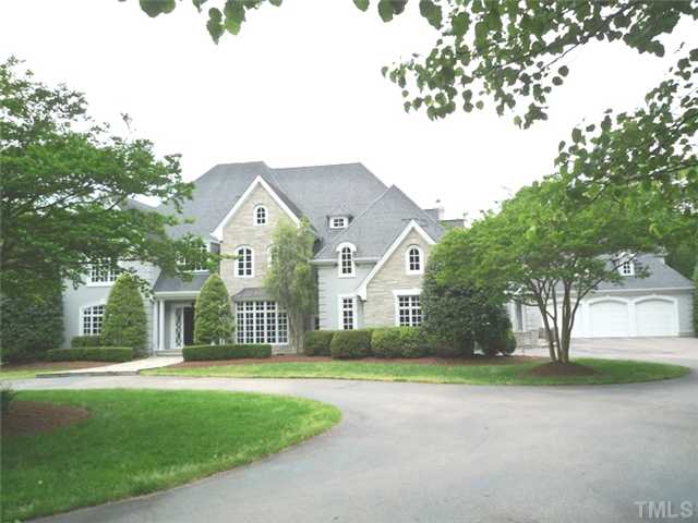 1817 Brassfield Road Raleigh, NC 27614 - Photo 1 of 25 a view of a white house with a big yard and large trees