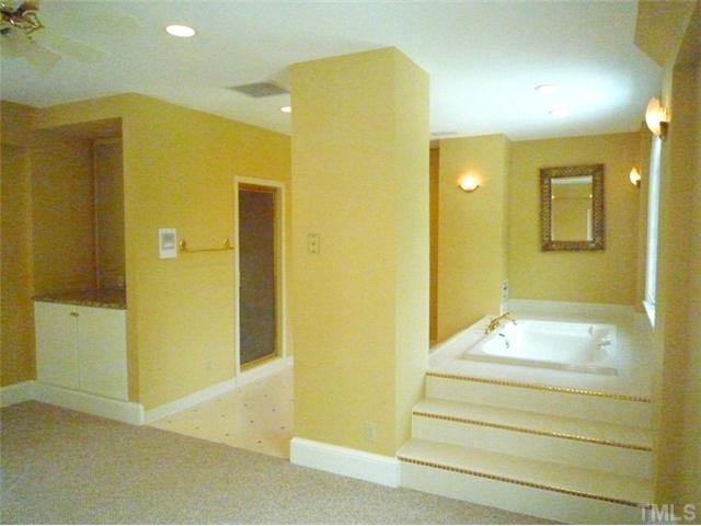 1817 Brassfield Road Raleigh, NC 27614 - Photo 13 of 25 a bathroom with a sink and a mirror