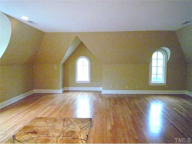 1817 Brassfield Road Raleigh, NC 27614 - Photo 16 of 25 a view of empty room with wooden floor and fan