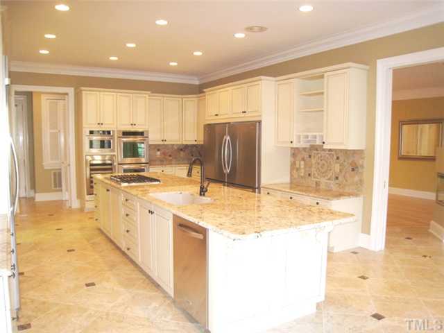 1817 Brassfield Road Raleigh, NC 27614 - Photo 6 of 25 a large bathroom with a granite countertop sink and a large mirror