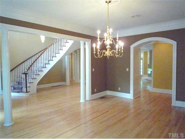 1817 Brassfield Road Raleigh, NC 27614 - Photo 8 of 25 a view of a hallway with wooden floor and staircase