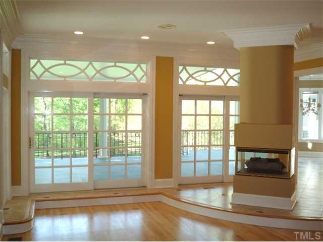 1817 Brassfield Road Raleigh, NC 27614 - Photo 9 of 25 a view of empty room with wooden floor and fan
