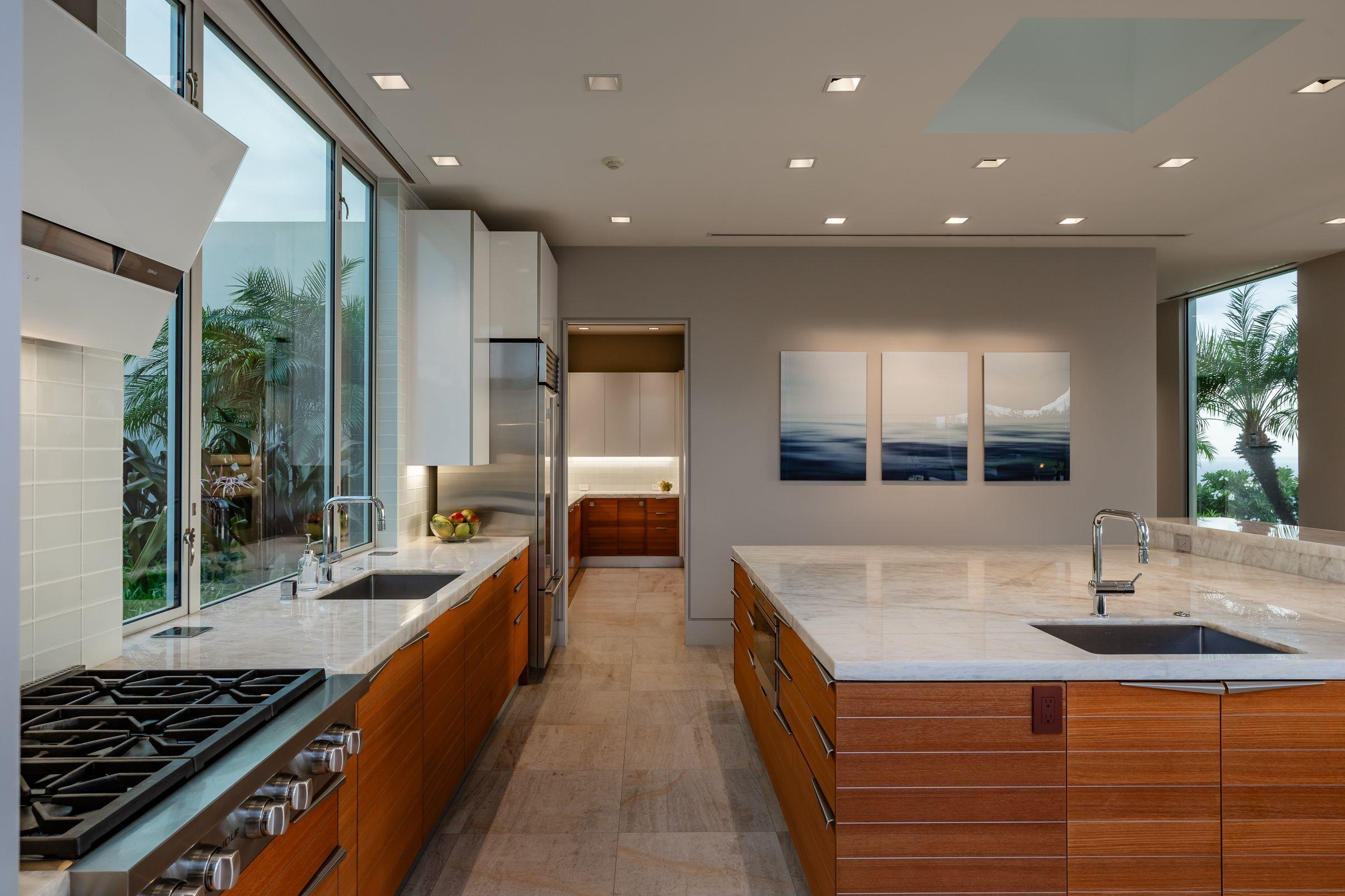 936 Punakea Loop Lahaina, HI 96761 - Photo 6 of 35 a kitchen with counter top space a sink and appliances