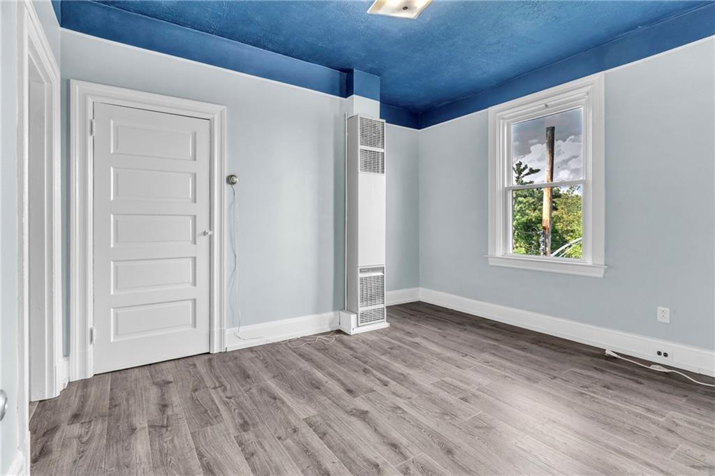 69 Transvaal Avenue Pittsburgh, PA 15212 - Photo 16 of 37 an empty room with wooden floor closet and windows