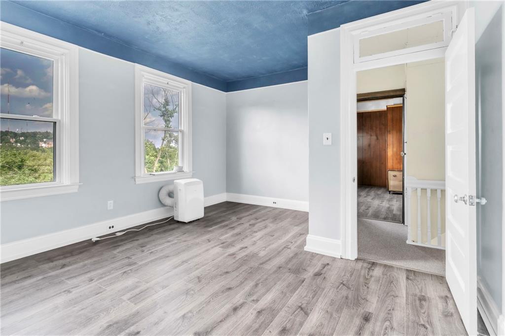 69 Transvaal Avenue Pittsburgh, PA 15212 - Photo 17 of 37 an empty room with windows and closet