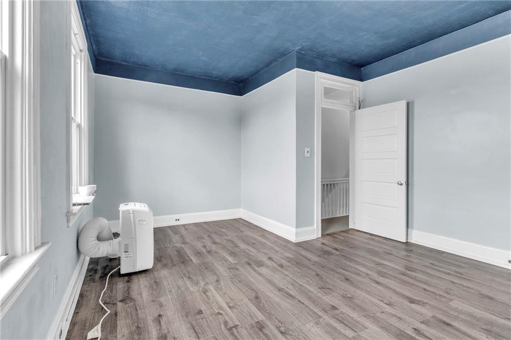 69 Transvaal Avenue Pittsburgh, PA 15212 - Photo 18 of 37 a room with wooden floor and windows