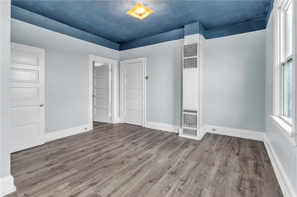 69 Transvaal Avenue Pittsburgh, PA 15212 - Photo 19 of 37 a view of empty room with wooden floor and fan