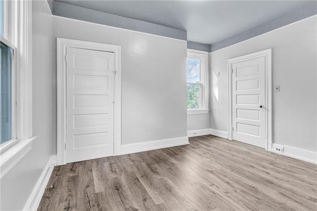 69 Transvaal Avenue Pittsburgh, PA 15212 - Photo 21 of 37 an empty room with wooden floor closet and windows