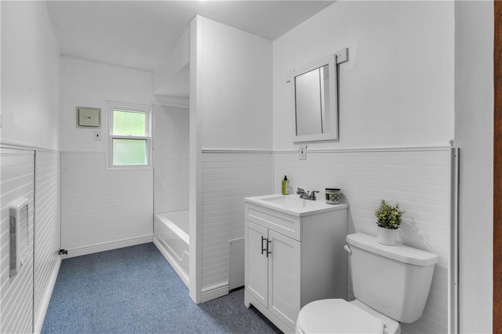69 Transvaal Avenue Pittsburgh, PA 15212 - Photo 23 of 37 a bathroom with a toilet sink and mirror