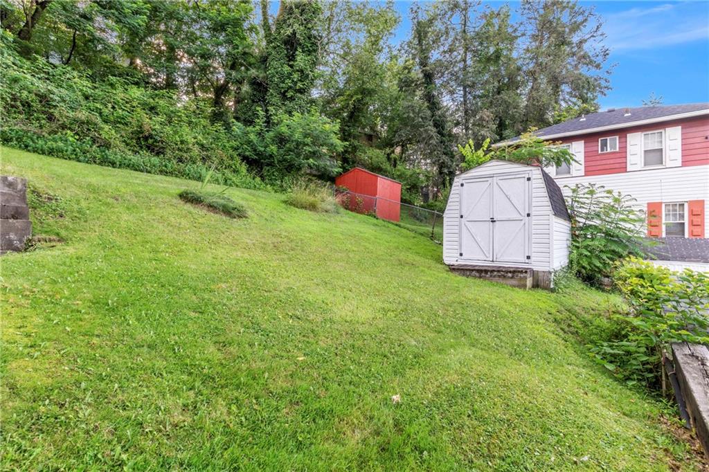 69 Transvaal Avenue Pittsburgh, PA 15212 - Photo 30 of 37 a backyard of a house with lots of green space and trampoline