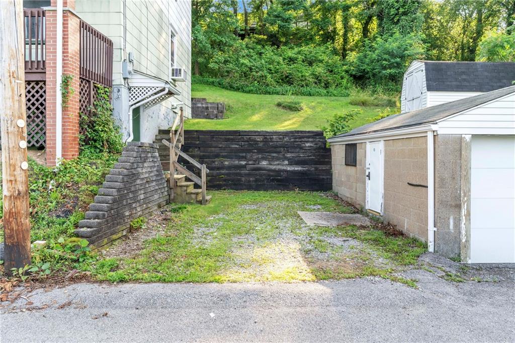69 Transvaal Avenue Pittsburgh, PA 15212 - Photo 31 of 37 a view of a house with backyard and wooden fence