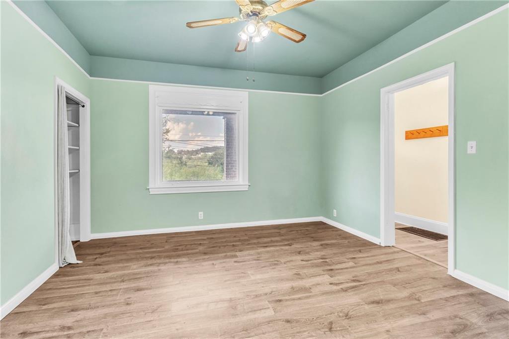 69 Transvaal Avenue Pittsburgh, PA 15212 - Photo 7 of 37 wooden floor in an empty room with a window