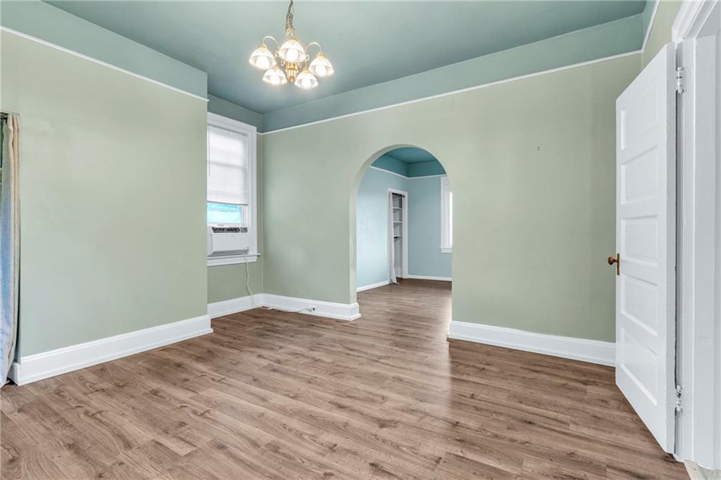69 Transvaal Avenue Pittsburgh, PA 15212 - Photo 8 of 37 a view of empty room with wooden floor and chandelier