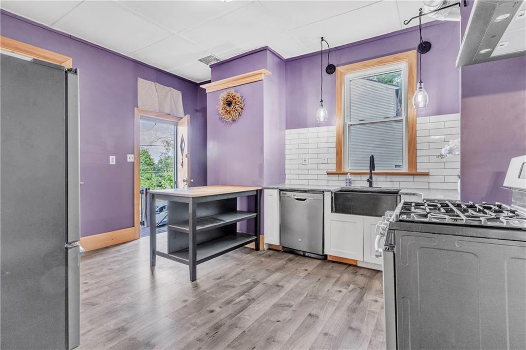 69 Transvaal Avenue Pittsburgh, PA 15212 - Photo 10 of 37 a kitchen with a stove and a sink