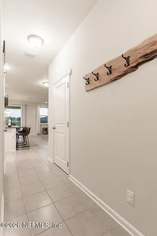 a dining room with stainless steel appliances kitchen island a table and chairs in it