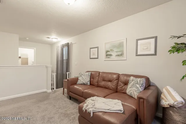 a living room with a couch and a table