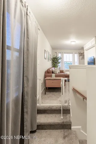 a bathroom with a granite countertop sink toilet and mirror