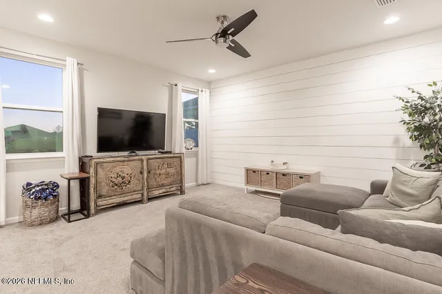 a metallic refrigerator freezer sitting in a kitchen