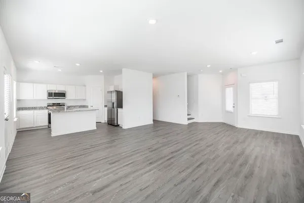 a view of kitchen with wooden floor