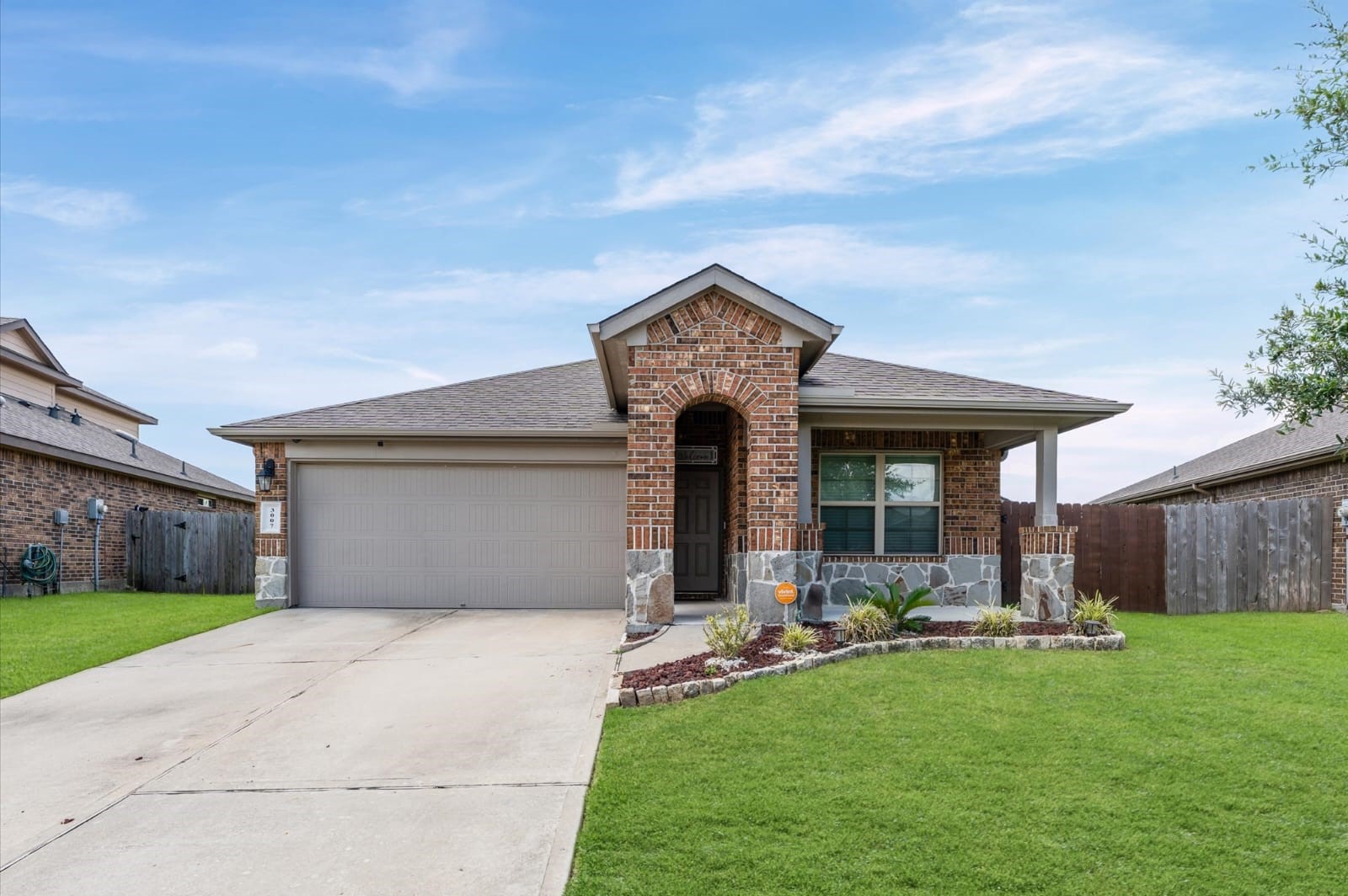 3007 Magellan Ridge Lane Baytown, TX 77521 - Photo 1 of 34 a front view of house with a garden