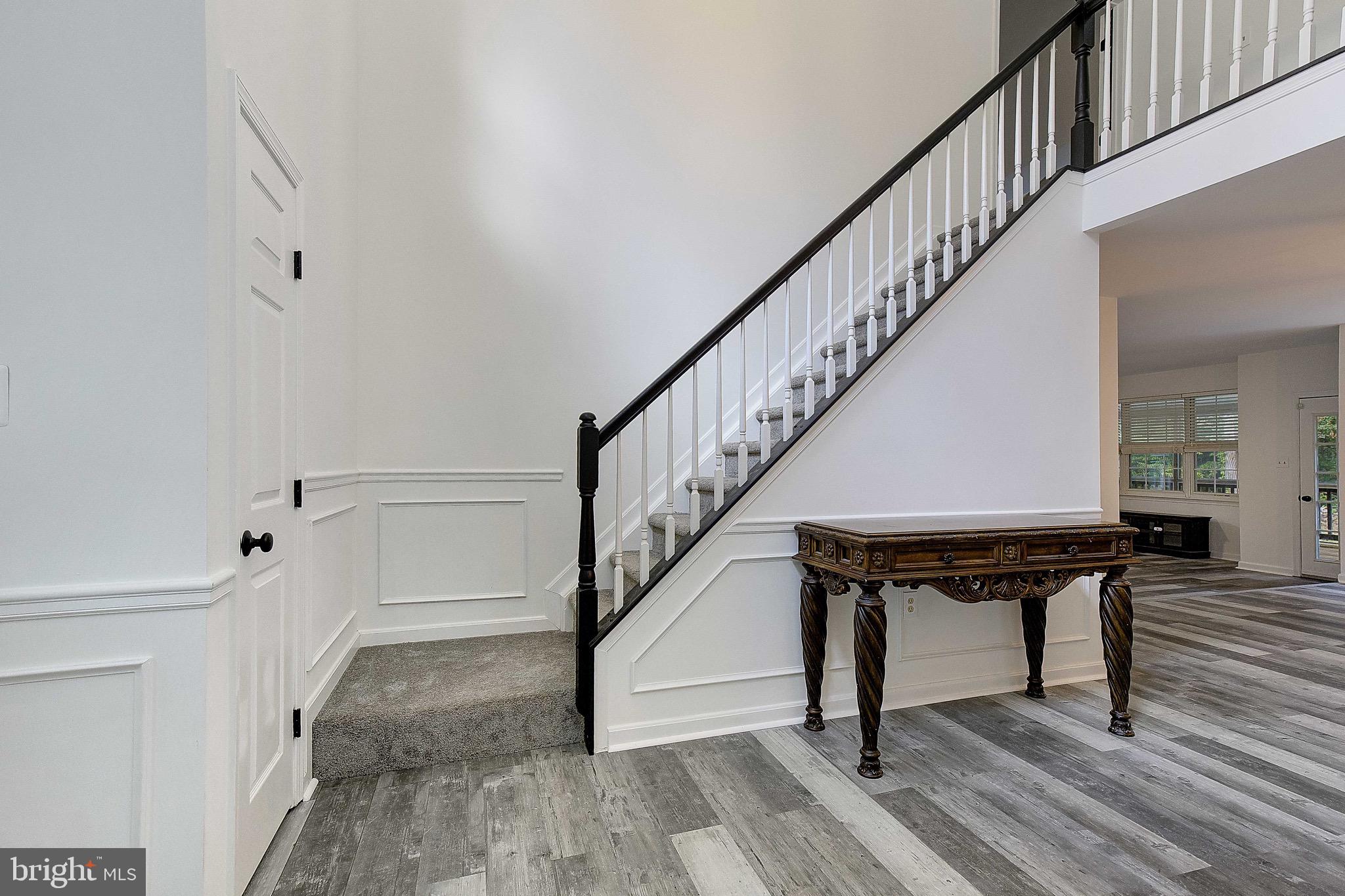 721 Small Reward Road Huntingtown, MD 20639 - Photo 7 of 51 a view of entryway and hall with wooden floor