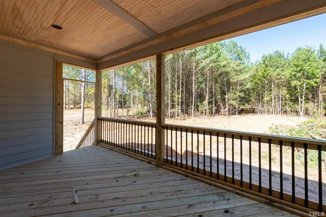 a view of porch with wooden floor
