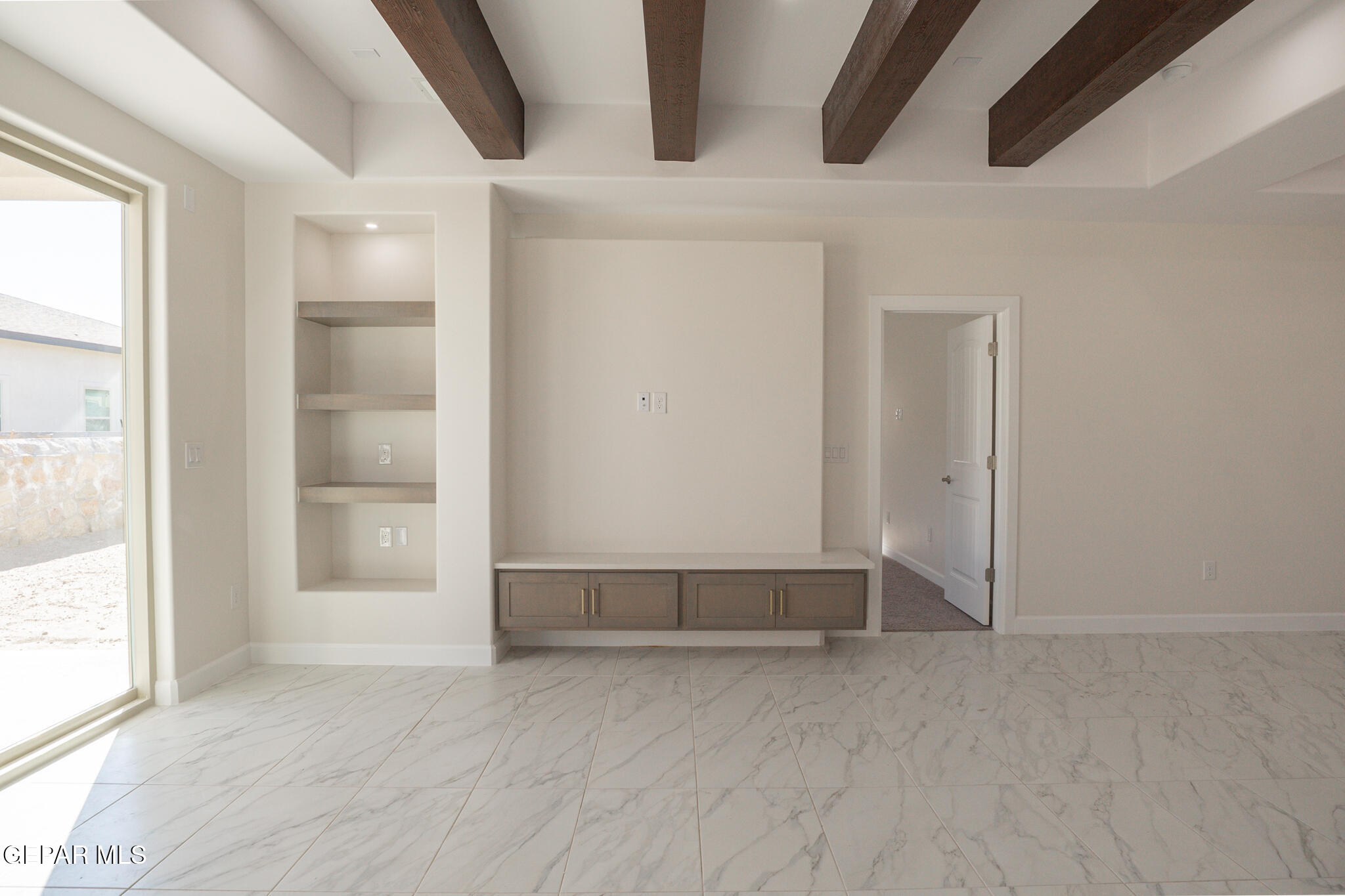3769 Course Street El Paso, TX 79938 - Photo 11 of 34 an empty room with wooden floor and windows