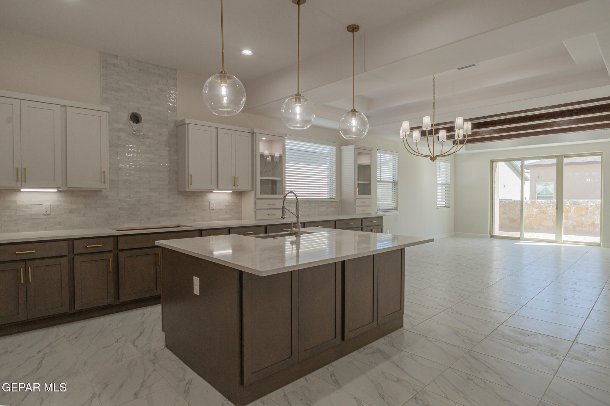 3769 Course Street El Paso, TX 79938 - Photo 12 of 34 a large kitchen with a sink and large cabinets