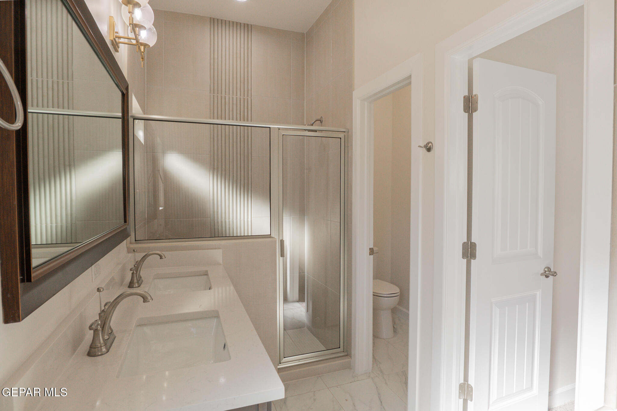 3769 Course Street El Paso, TX 79938 - Photo 17 of 34 a bathroom with a sink and a mirror