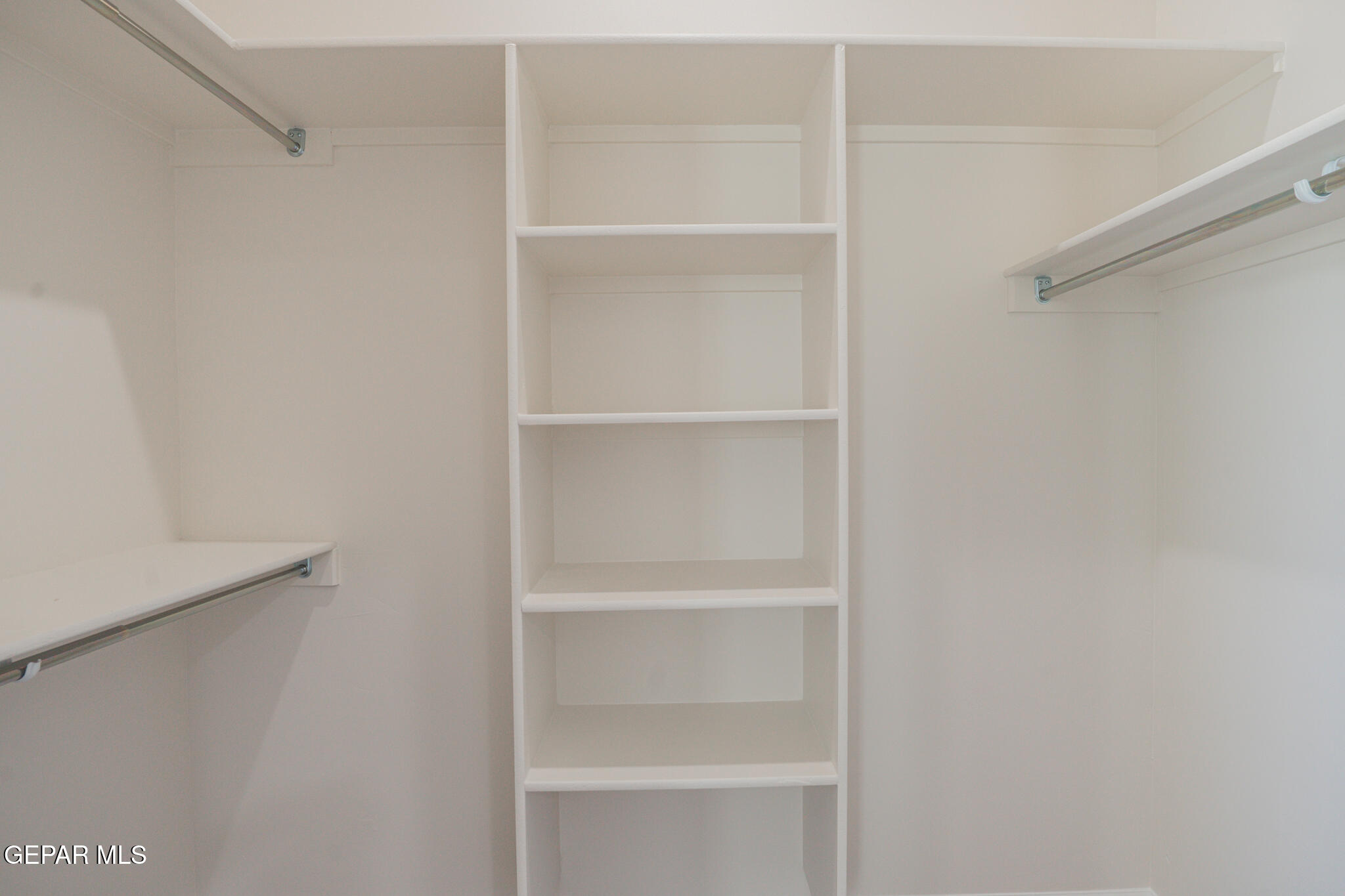 3769 Course Street El Paso, TX 79938 - Photo 33 of 34 a view of walk in closet with empty racks