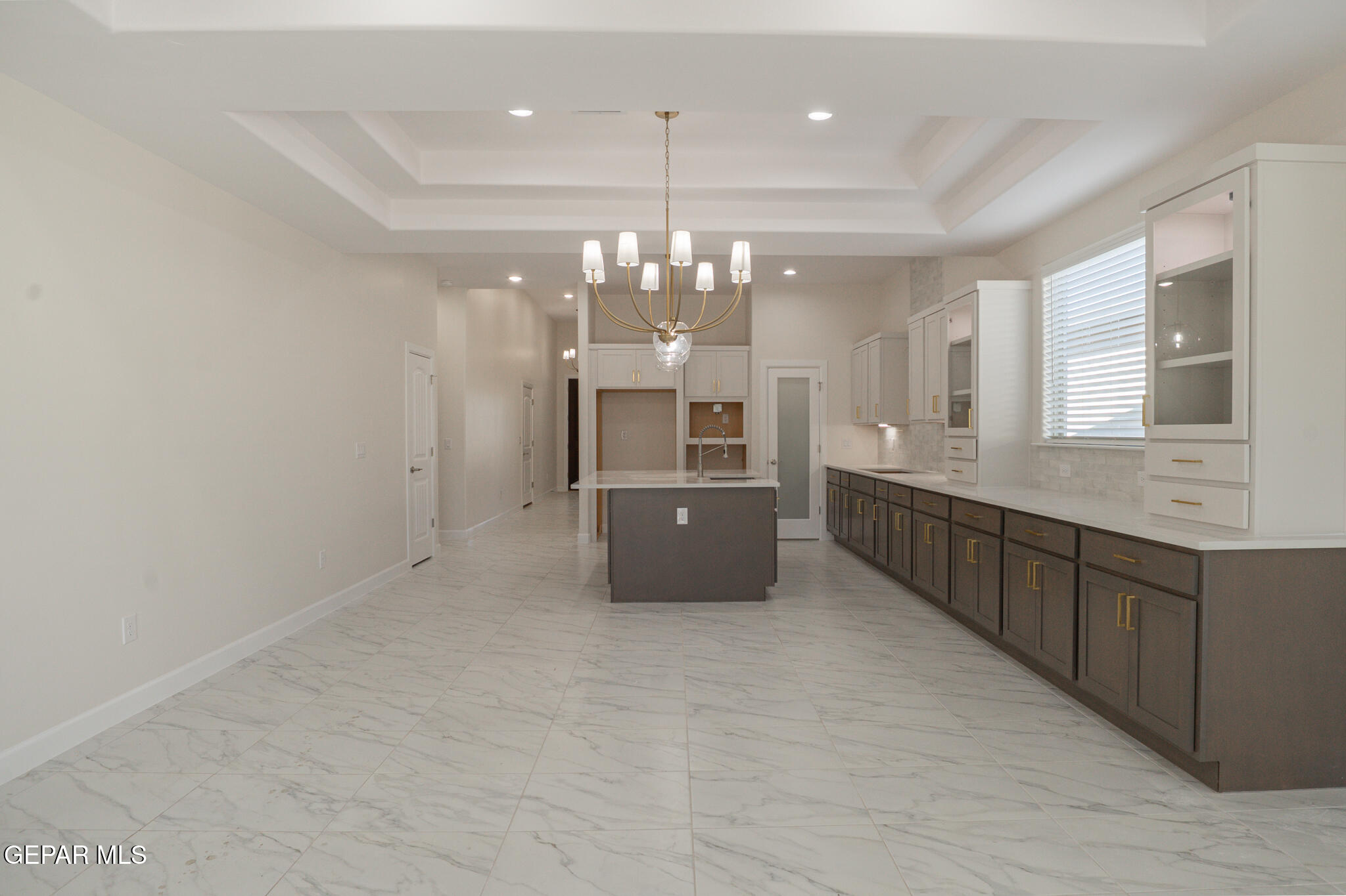 3769 Course Street El Paso, TX 79938 - Photo 5 of 34 a large kitchen with granite countertop a large counter top and cabinets