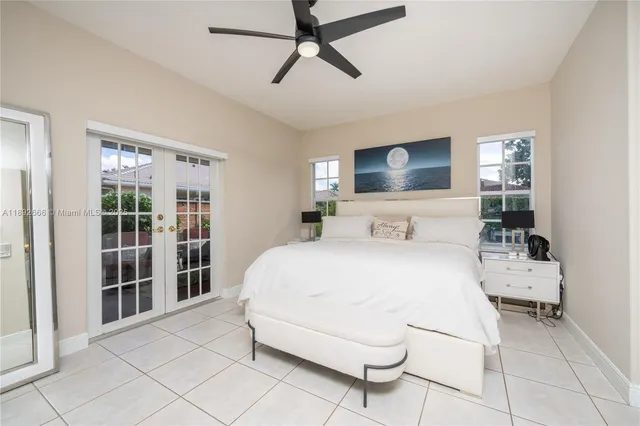 a bedroom with a bed and a table